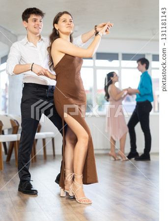 Couple young woman and man dancing waltz 131181143