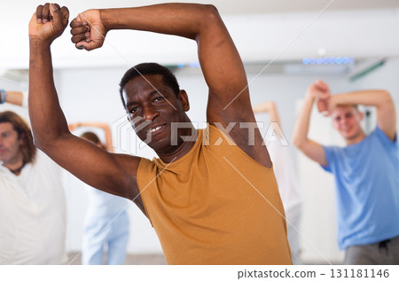 African american man with friends training hip hop in dance studio 131181146