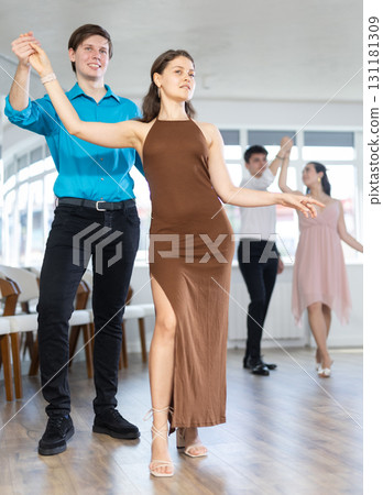 Couple young woman and man dancing waltz Couple young woman and man dancing waltz 131181309