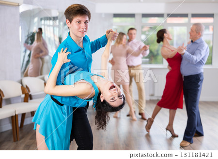 Couple showcasing dip while dancing waltz in choreography studio Couple showcasing dip while dancing waltz in choreography studio 131181421