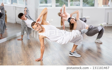 Group of dancers having break dance training at dance studio Group of dancers having break dance training at dance studio 131181467