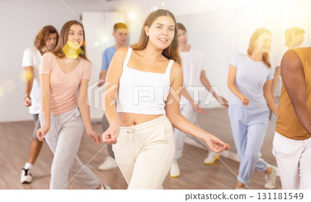 Group of different people rehearsing dance in dance studio 131181549