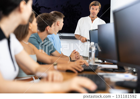 Male teacher enthusiastically explains 131181592