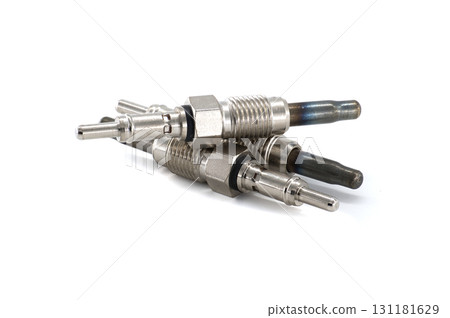 Close-up view of several new glow plugs, key components for diesel engine ignition, on white. Close-up view of several new glow plugs, key components for diesel engine ignition, on white. 131181629