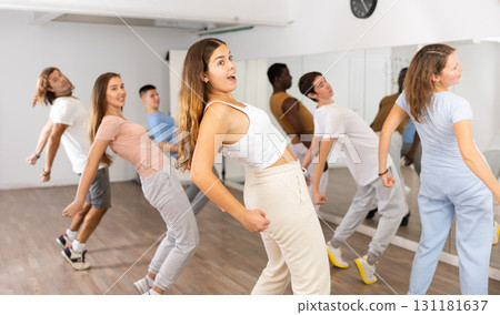 Group of different people rehearsing dance in dance studio 131181637