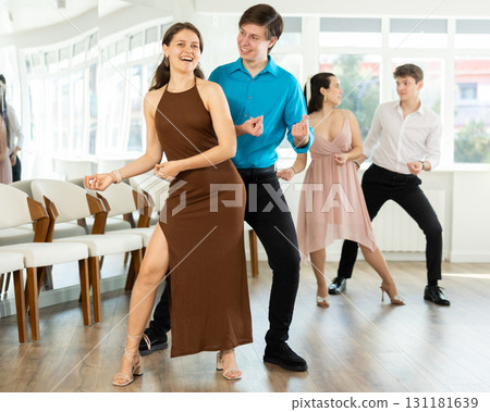 Couple young woman and man dancing twist Couple young woman and man dancing twist 131181639