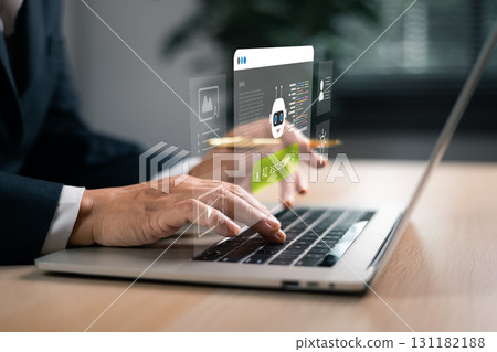 Businessman using laptop with AI assistant chatbot interface, digital innovation and smart automation technology for corporate communication, productivity and artificial intelligence solutions. 131182188