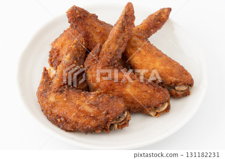 Deep fried chicken wings on a plate on a white background 131182231