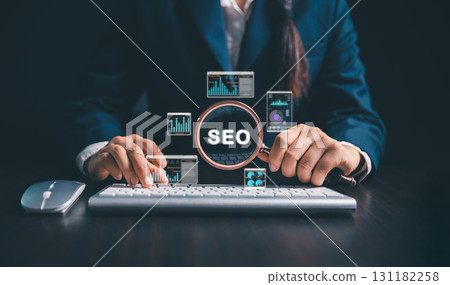 Women using magnifying glasses, computers focus on SEO analysis, search engine optimization to improve website ranking, increase internet traffic, promote business websites through modern technology. 131182258