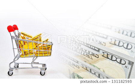 Gold bars in shopping cart and US dollar bill banknotes on white background. online concept asset commodity trading or buy gold bars for investment 131182593