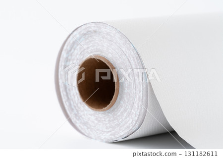 Close-up of a roll of white wallpaper sheets Close-up of a roll of white wallpaper sheets 131182611