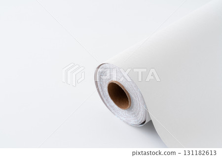 Close-up of a roll of white wallpaper sheets 131182613