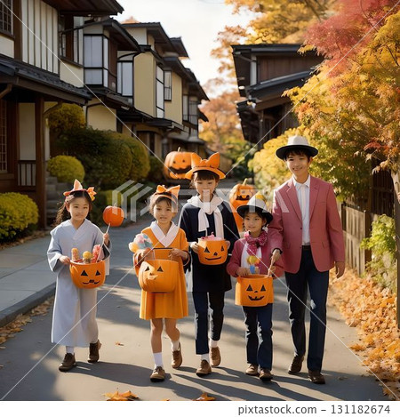 Children in Halloween costumes walking through an autumn residential area, festive scene with pumpkin baskets in hand 131182674