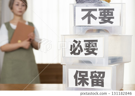 Senior woman decluttering in the living room Senior woman decluttering in the living room 131182846