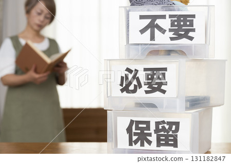 Senior woman decluttering in the living room 131182847