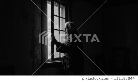 An elderly man near the window 131183844