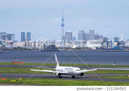 View of Haneda Airport, taxiing planes and Tokyo Skytree, Ota Ward, Tokyo 131184563