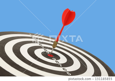 Dart embedded in the center of a target showing achievement Dart embedded in the center of a target showing achievement 131185855