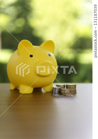 Piggy Bank with money Coin on Table. Saving and Banking concept 131187039