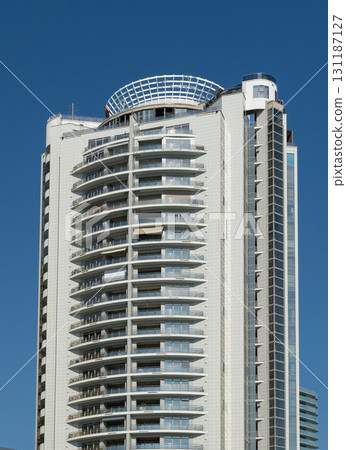Glass facade of a hotel building in a resort town. 131187127