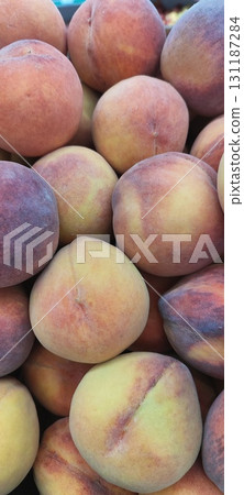 The peaches are ripe and sweet, the flesh is tender and juicy. A container filled with peaches. 131187284