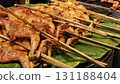 Thai grilled chicken on a rotisserie. 131188404