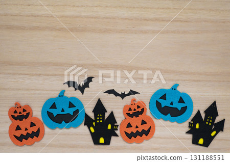 Halloween decorations on a wood grain background Halloween decorations on a wood grain background 131188551