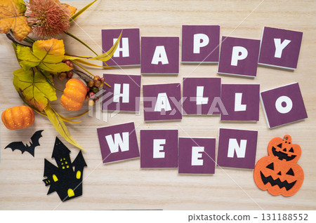 Halloween decorations on a wood grain background Halloween decorations on a wood grain background 131188552