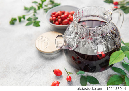 Rosehip herbal tea brewing in glass teapot Rosehip herbal tea brewing in glass teapot 131188944