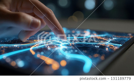 Stylized digital tablet displaying vibrant city map with glowing lines and finger interaction at night 131189779