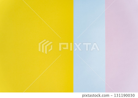 Abstract background with vertical yellow, blue, and pink paper strips Abstract background with vertical yellow, blue, and pink paper strips 131190030
