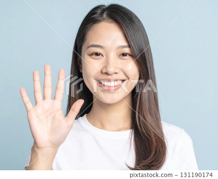 A young Japanese woman showing her right palm A young Japanese woman showing her right palm 131190174