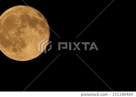 A full moon floating in the dark night, with even the craters visible A full moon floating in the dark night, with even the craters visible 131190484