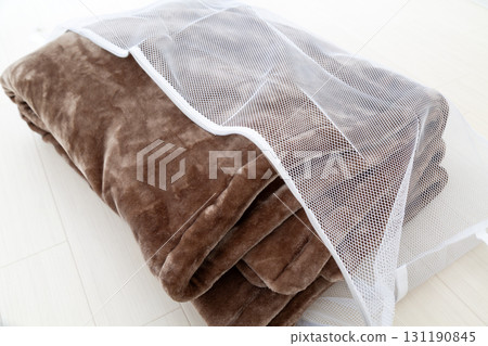 Brown blanket and laundry net 131190845