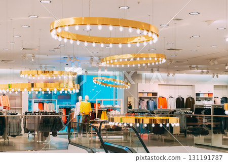 Mannequins Dressed In Female Woman Casual Clothes And Clothes On Shelves And Hanger In Store Of Shopping Center Mannequins Dressed In Female Woman Casual Clothes And Clothes On Shelves And Hanger In Store Of Shopping Center 131191787
