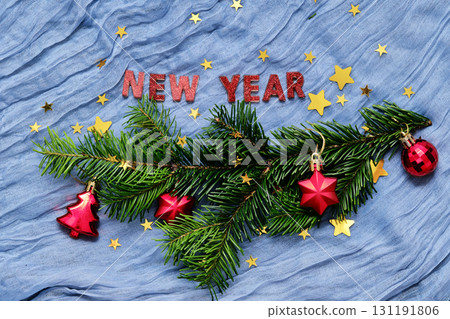 New Year's background with a Christmas tree branch and toys. 131191806