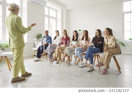 Group of young diverse women having a meeting with a professional business coach Group of young diverse women having a meeting with a professional business coach 131192157