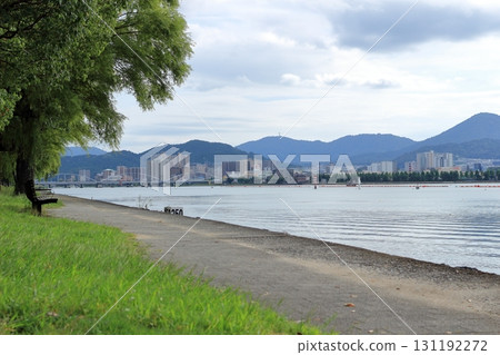 The promenade along Lake Biwa and the cityscape on the opposite shore 131192272