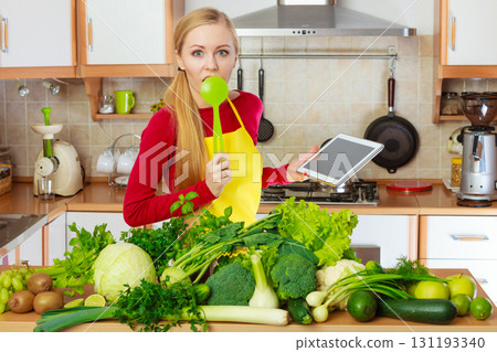 Woman having green vegetables thinking about cooking 131193340