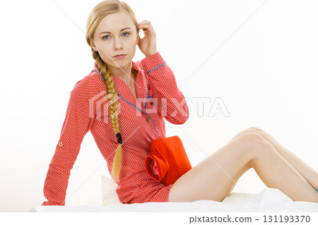 Woman feeling stomach cramps lying on bed Woman feeling stomach cramps lying on bed 131193370