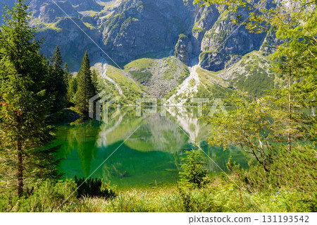 landscape with lake in mountains. scenic nature of poland with rocky peaks in summer. high tatras are wonderful place for travel in eastern europe 131193542