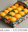 Box of oranges with a floral design on it 131193586