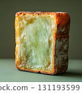Slice of bread with a white filling is shown 131193599