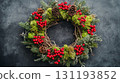 Festive Christmas wreath made of pinecones, red berries, moss, and evergreen branches on a dark textured background, symbolizing holiday decor 131193852