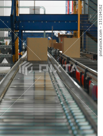 logistic warehouse. packing line in a logistics warehouse. conveyor belt in a modern production line 131194162