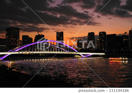 The illuminated Tsukiji Bridge and Tokyo Tower shine in the sunset. September 905 Tokyo Tower and Tsukiji Bridge at dusk The illuminated Tsukiji Bridge and Tokyo Tower shine in the sunset. September 905 Tokyo Tower and Tsukiji Bridge at dusk 131194386