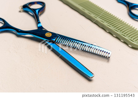Blue thinning shears and comb for hairdressing 131195543
