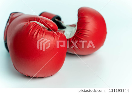 Red boxing gloves symbolizing power, fight, and sport Red boxing gloves symbolizing power, fight, and sport 131195544