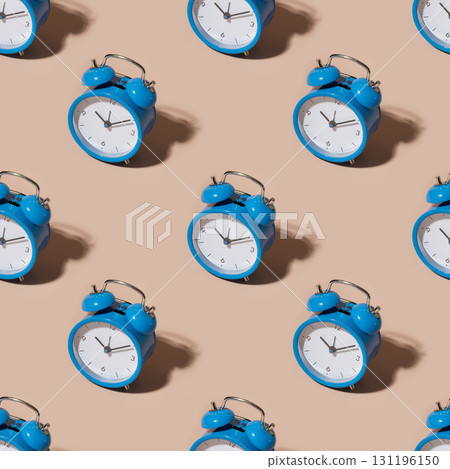 Seamless pattern of vintage blue alarm clock on beige background 131196150