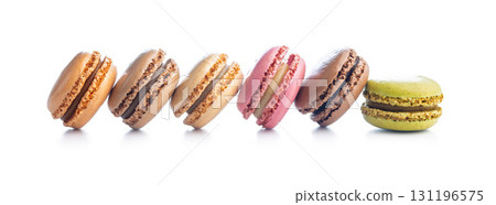 Different flavors of macarons. Colourful macaroons isolated on white background. 131196575